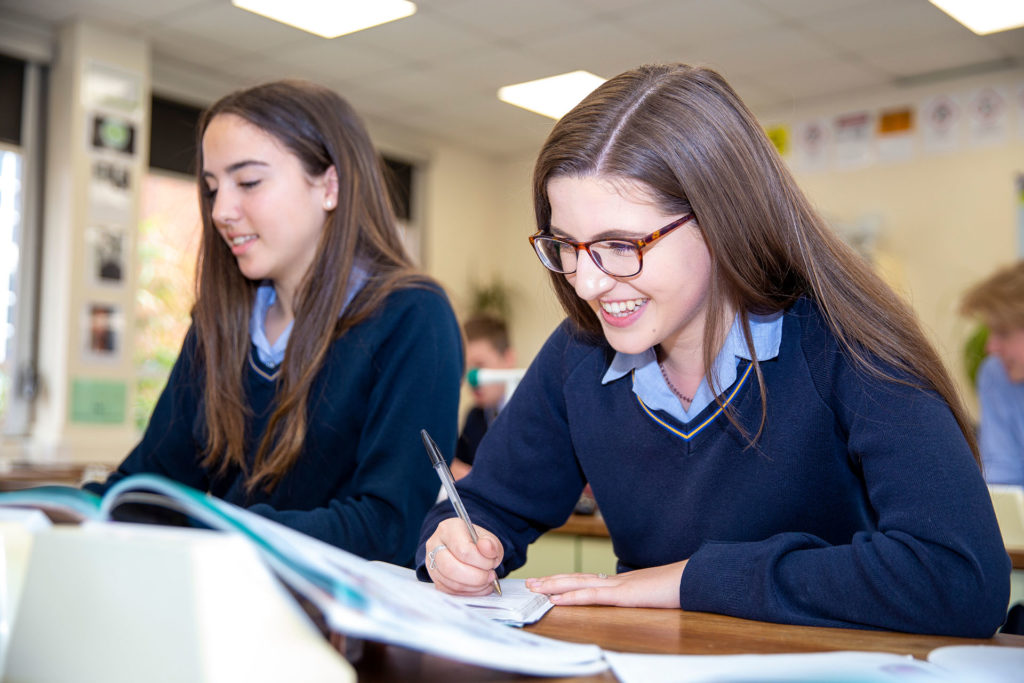 girls in lesson smiling academic senior