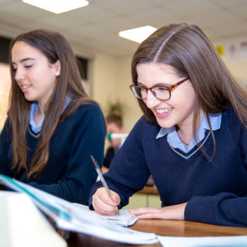 girls in lesson smiling academic senior